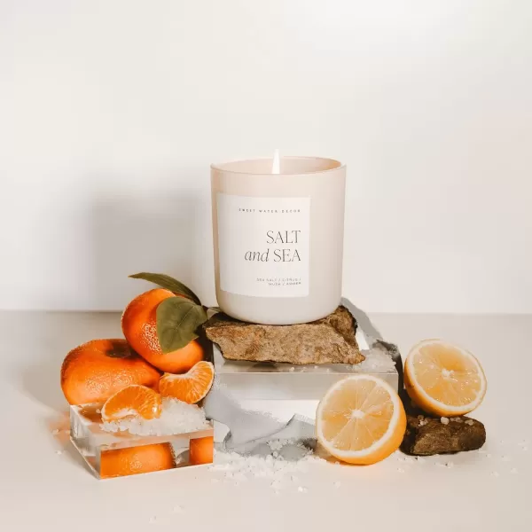 imageSweet Water Decor By The Fireside Candle  Vanilla Caramel Amber Tonka Smoky Woods Musk Winter Scented Soy Candles for Home  15oz Tan Jar 70 Hour Burn Time Made in the USATan