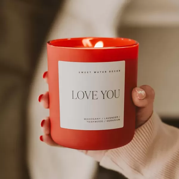 imageSweet Water Decor By The Fireside Candle  Vanilla Caramel Amber Tonka Smoky Woods Musk Winter Scented Soy Candles for Home  15oz Tan Jar 70 Hour Burn Time Made in the USARed