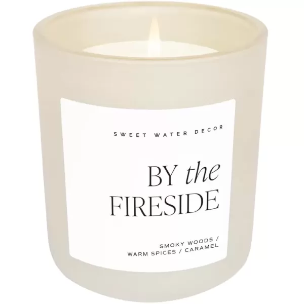 imageSweet Water Decor By The Fireside Candle  Vanilla Caramel Amber Tonka Smoky Woods Musk Winter Scented Soy Candles for Home  15oz Tan Jar 70 Hour Burn Time Made in the USATan