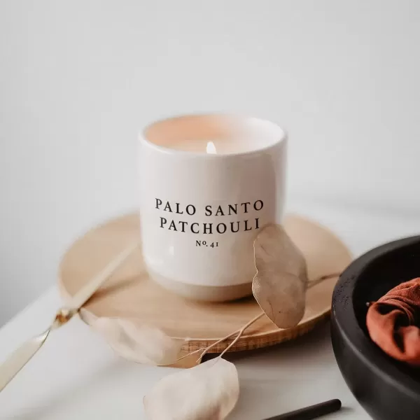 imageSweet Water Decor Christmas Candle  Apple Cider Cinnamon Fresh Cut Christmas Tree and Cookies Scented Soy Candle for Home  12oz Black Stoneware Jar 60 Hour Burn Time Made in the USAPalo Santo Patchouli