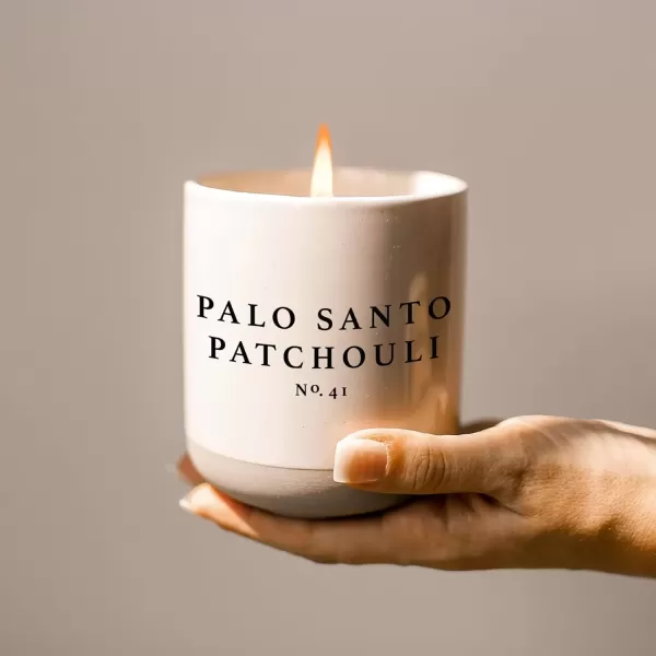 imageSweet Water Decor Christmas Candle  Apple Cider Cinnamon Fresh Cut Christmas Tree and Cookies Scented Soy Candle for Home  12oz Black Stoneware Jar 60 Hour Burn Time Made in the USAPalo Santo Patchouli