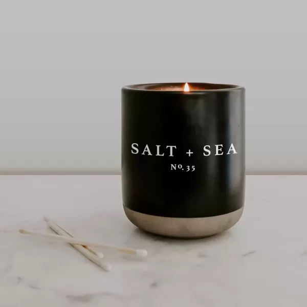imageSweet Water Decor Christmas Candle  Apple Cider Cinnamon Fresh Cut Christmas Tree and Cookies Scented Soy Candle for Home  12oz Black Stoneware Jar 60 Hour Burn Time Made in the USASalt  Sea