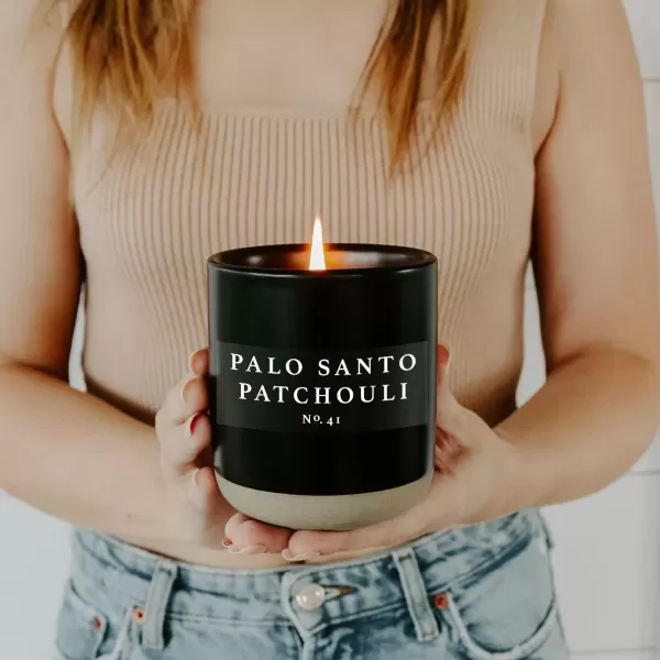 imageSweet Water Decor Christmas Candle  Apple Cider Cinnamon Fresh Cut Christmas Tree and Cookies Scented Soy Candle for Home  12oz Black Stoneware Jar 60 Hour Burn Time Made in the USAPalo Santo Patchouli