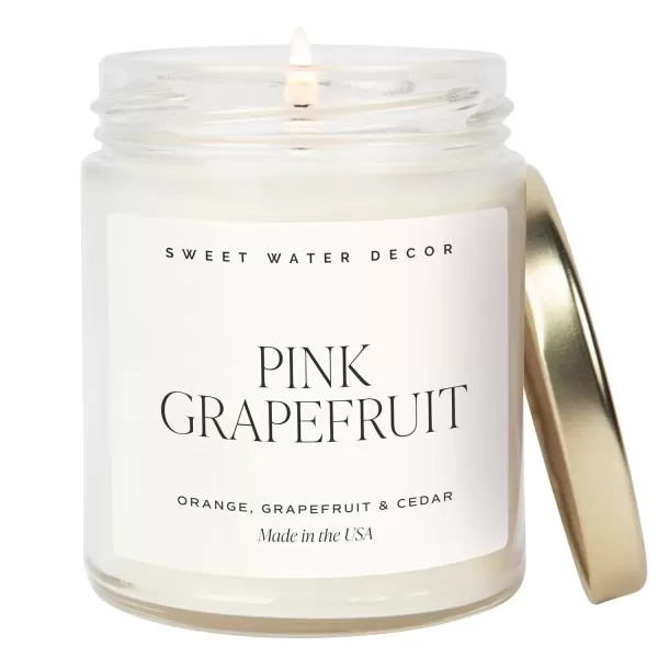 imageSweet Water Decor Christmas Candle  Cinnamon Trees Orange and Clove Scents  Christmas Candles and Decor for Home  9oz Clear Jar Soy Candle Made in the USAPink Grapefruit