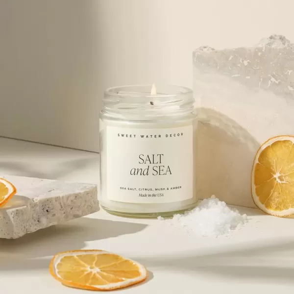 imageSweet Water Decor Christmas Candle  Cinnamon Trees Orange and Clove Scents  Christmas Candles and Decor for Home  9oz Clear Jar Soy Candle Made in the USASalt and Sea