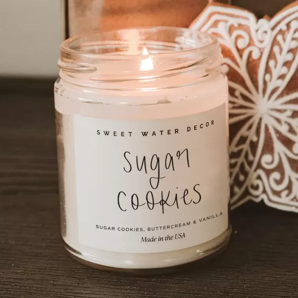 imageSweet Water Decor Christmas Candle  Cinnamon Trees Orange and Clove Scents  Christmas Candles and Decor for Home  9oz Clear Jar Soy Candle Made in the USASugar Cookies