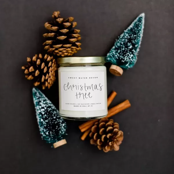 imageSweet Water Decor Christmas Tree Candle  Pine Needles Cedarwood Cypress and Evergreen Soy Holiday Scented Candles for Home  9oz Clear Jar Candle 40 Hour Burn Time Made in the USAChristmas Tree