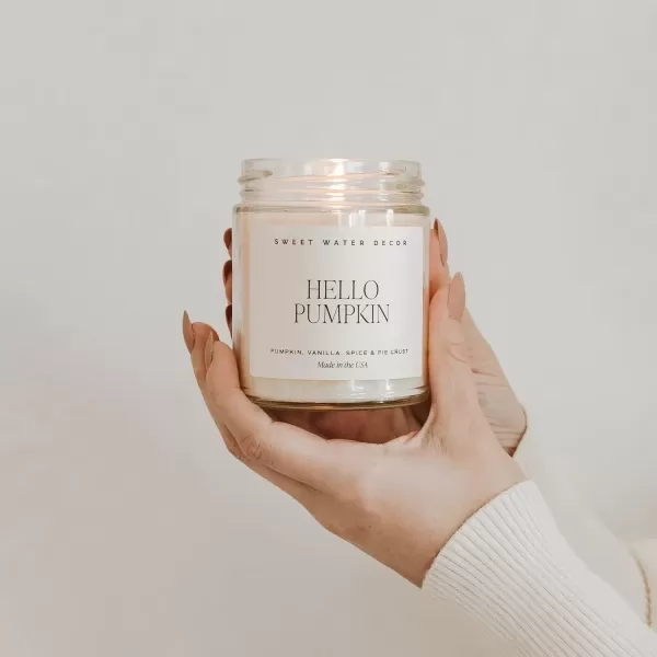 imageSweet Water Decor Christmas Tree Candle  Pine Needles Cedarwood Cypress and Evergreen Soy Holiday Scented Candles for Home  9oz Clear Jar Candle 40 Hour Burn Time Made in the USAHello Pumpkin