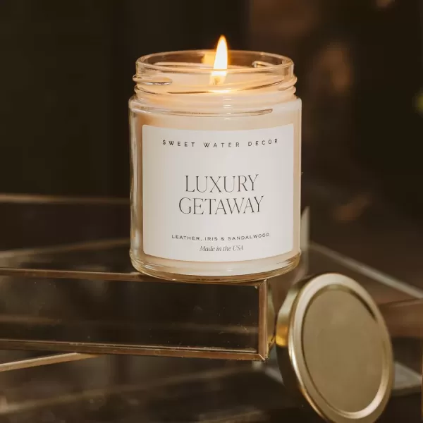 imageSweet Water Decor Christmas Tree Candle  Pine Needles Cedarwood Cypress and Evergreen Soy Holiday Scented Candles for Home  9oz Clear Jar Candle 40 Hour Burn Time Made in the USALuxury Getaway