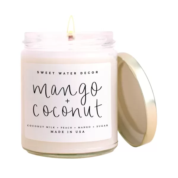 imageSweet Water Decor Christmas Tree Candle  Pine Needles Cedarwood Cypress and Evergreen Soy Holiday Scented Candles for Home  9oz Clear Jar Candle 40 Hour Burn Time Made in the USAMango and Coconut
