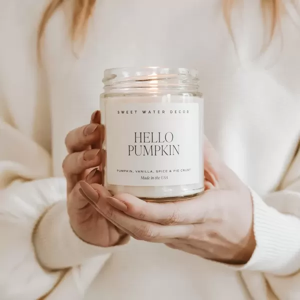 imageSweet Water Decor Christmas Tree Candle  Pine Needles Cedarwood Cypress and Evergreen Soy Holiday Scented Candles for Home  9oz Clear Jar Candle 40 Hour Burn Time Made in the USAHello Pumpkin