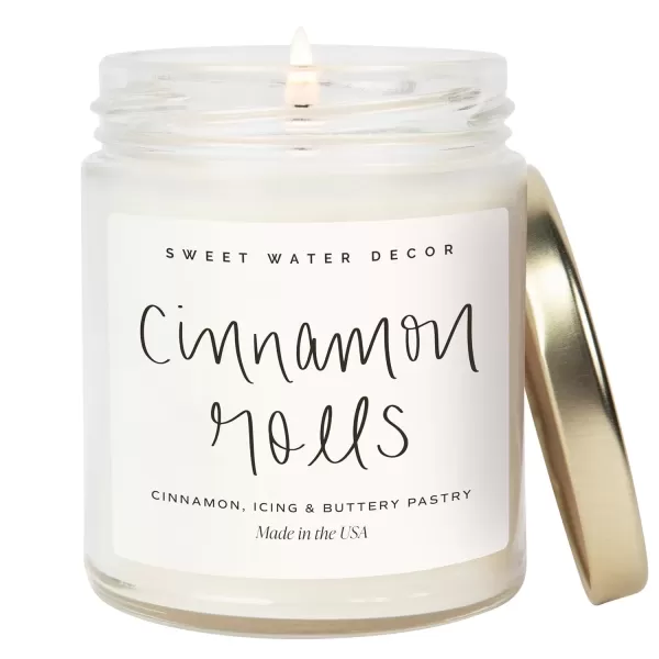 imageSweet Water Decor Christmas Tree Candle  Pine Needles Cedarwood Cypress and Evergreen Soy Holiday Scented Candles for Home  9oz Clear Jar Candle 40 Hour Burn Time Made in the USACinnamon Rolls