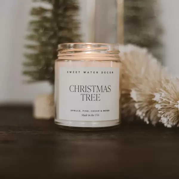 imageSweet Water Decor Christmas Tree Candle  Pine Needles Cedarwood Cypress and Evergreen Soy Holiday Scented Candles for Home  9oz Clear Jar Candle 40 Hour Burn Time Made in the USAChristmas Tree