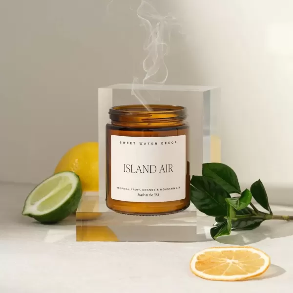 imageSweet Water Decor Island Air Soy Candle  Tropical Fruit Mountain Air and Orange Scented Summer Candles for Home  9oz Amber Jar  Black Lid 40 Hour Burn Time Made in the USAIsland Air