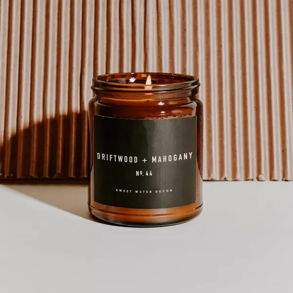 imageSweet Water Decor Palo Santo Patchouli Candle  Vanilla Musk Sandalwood Patchouli Scented Soy Candles for Home  Gifts for Women Men Housewarming  9oz Amber Jar 40 Hour Burn TimeDriftwood and Mahogany