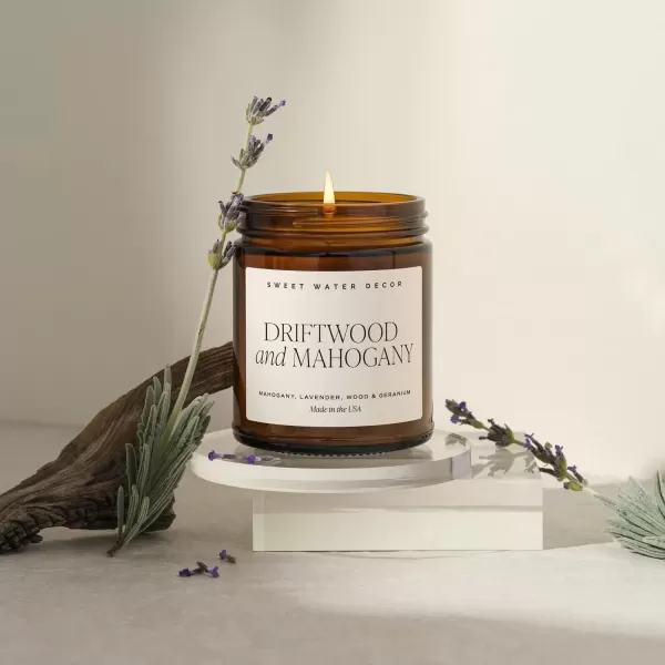 imageSweet Water Decor Palo Santo Patchouli Candle  Vanilla Musk Sandalwood Patchouli Scented Soy Candles for Home  Gifts for Women Men Housewarming  9oz Amber Jar 40 Hour Burn TimeDriftwood and Mahogany
