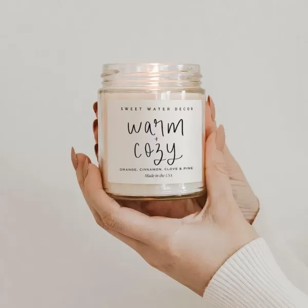 imageSweet Water Decor Relaxation Soy Candle  Eucalyptus Peppermint and Clove Scented Candles for Home  9oz Clear Jar  Gold Lid 40 Hour Burn Time Made in the USAWarm and Cozy