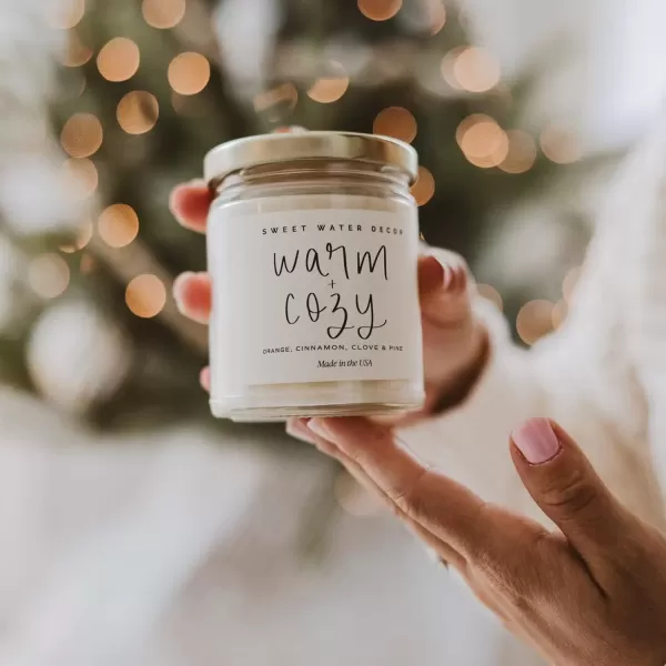 imageSweet Water Decor Relaxation Soy Candle  Eucalyptus Peppermint and Clove Scented Candles for Home  9oz Clear Jar  Gold Lid 40 Hour Burn Time Made in the USAWarm and Cozy