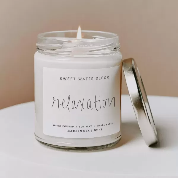 imageSweet Water Decor Relaxation Soy Candle  Eucalyptus Peppermint and Clove Scented Candles for Home  9oz Clear Jar  Gold Lid 40 Hour Burn Time Made in the USARelaxation