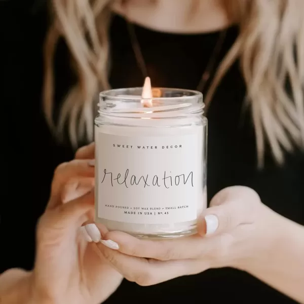 imageSweet Water Decor Relaxation Soy Candle  Eucalyptus Peppermint and Clove Scented Candles for Home  9oz Clear Jar  Gold Lid 40 Hour Burn Time Made in the USARelaxation