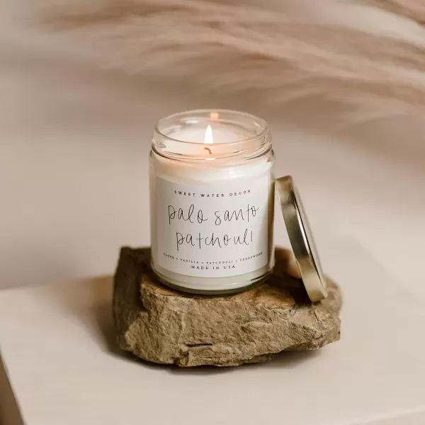 imageSweet Water Decor Relaxation Soy Candle  Eucalyptus Peppermint and Clove Scented Candles for Home  9oz Clear Jar  Gold Lid 40 Hour Burn Time Made in the USAPalo Santo Patchouli