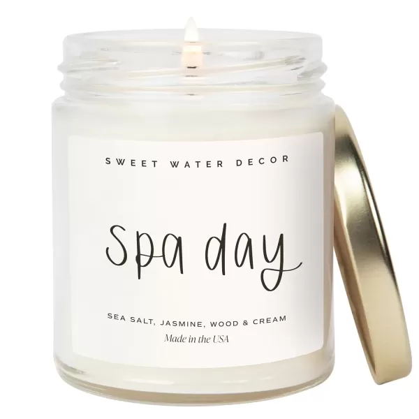 imageSweet Water Decor Spa Day Soy Candle  Sea Salt Jasmine Wood and Cream Scented Candles for Home  9oz Clear Jar  Gold Lid 40 Hour Burn Time Made in the USASpa Day