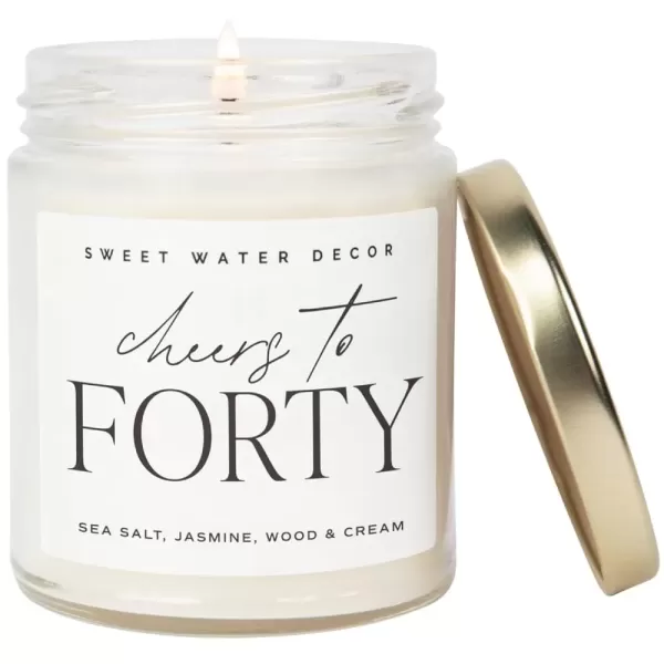 imageSweet Water Decor Cheers to Forty Candle  Sea Salt Jasmine Wood and Cream Scented Candle for Home  9oz Clear Jar with 40 Hour Burn Time Made in USA  40th Anniversary and Birthday GiftsCheers to Forty