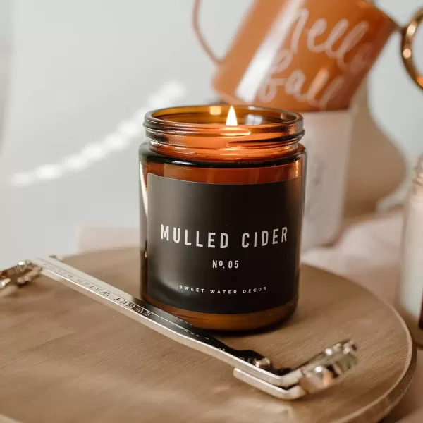 imageSweet Water Decor Cinnamon Roll Candle  Fall Candle with Cinnamon Icing and Cinnamon Buttery Pastry for Home  Cinnamon Soy Candle with 40 Hours Burn Time  9Oz Black Lid Amber Jar Cinnamon ScentsMulled Cider