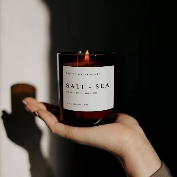 imageSweet Water Decor Salt and Sea Candle  Sea Salt Citrus Amber Musk Beach Scented Soy Candles for Home  11oz White Glass Jar  Wood Lid 50 Hour Burn Time Made in the USAAmber
