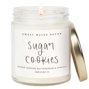 imageSweet Water Decor Christmas Scented Candle  Cinnamon Trees Orange and Clove Scented Winter Candle  Christmas Candles and Decor for Home  9oz Clear Jar Soy Candle Made in the USASugar Cookies