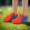 imagePANDANINJIA Girls Soccer Cleats Athletic Outdoor Boys Kids Football Cleats Little Big Kid Soccer ShoesOrangeblue