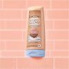 imageJergens Natural Glow Inshower Lotion Self Tanner for Medium to Deep Skin Tone Wet Skin Lotion Sunless Tanner Locks in Hydration for Gradual Flawless Color 75 Ounce Pack of 2Medium to Tan