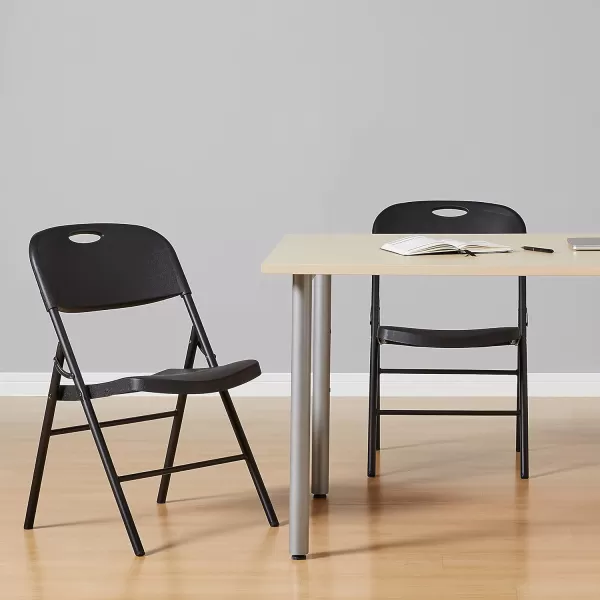Amazon Basics Folding Plastic Chair 350Pound Capacity White 4Pack2Pack Black