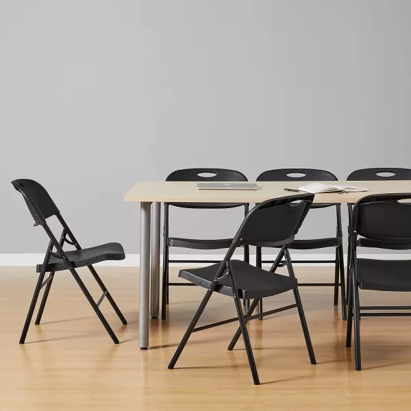 Amazon Basics Folding Plastic Chair 350Pound Capacity White 4Pack6Pack Black