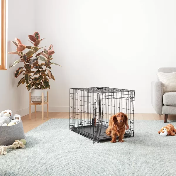 imageAmazon Basics  DurableFoldable Metal Wire Dog Crate with Tray Double Door Divider 24 x 18 x 20 Inches Black300L x 190W x 210H