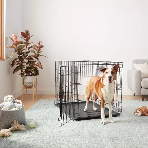 imageAmazon Basics  DurableFoldable Metal Wire Dog Crate with Tray Double Door Divider 24 x 18 x 20 Inches Black420L x 280W x 300H