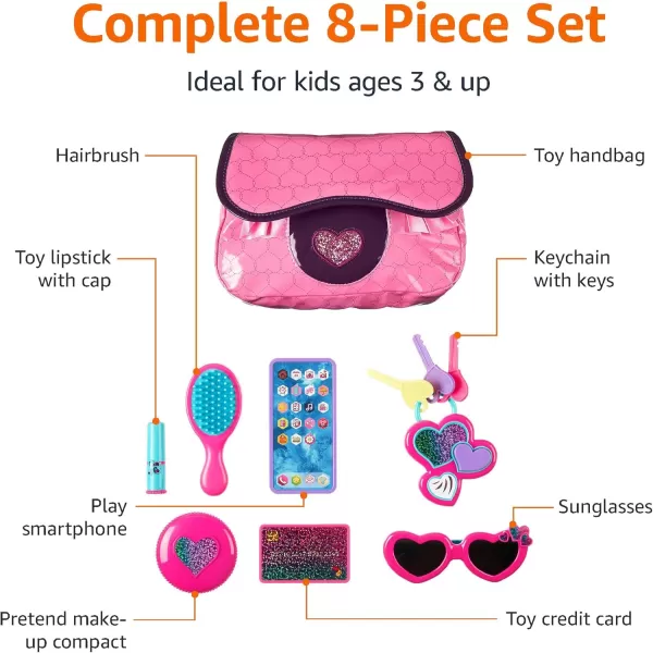 imageAmazon Basics 8Piece Pretend Play Purse Toy with Accessories for Girls Ages 3 and Up Handbag Gift Set Including Smartphone Sunglasses Makeup Compact Keys and Credit Card Pink