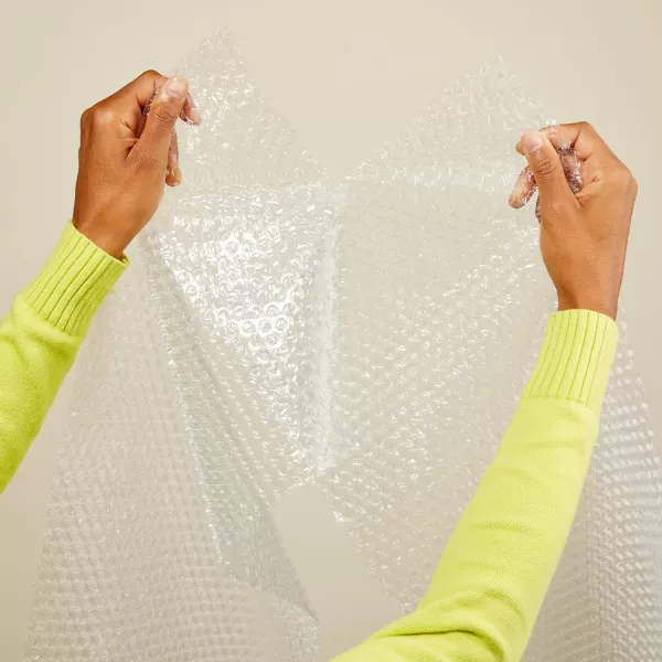 imageAmazon Basics Perforated Bubble Cushioning Wrap Large Clear 516quot 12Inch x 100Foot Long RollClear