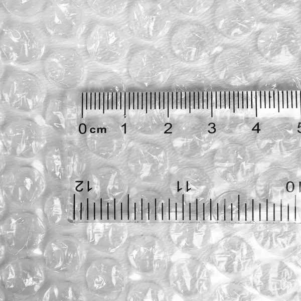 imageAmazon Basics Perforated Bubble Cushioning Wrap Large Clear 516quot 12Inch x 100Foot Long RollClear