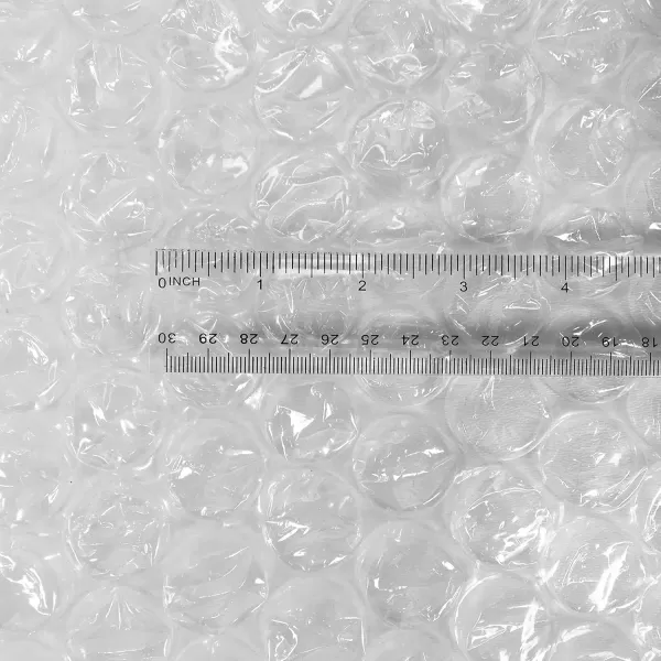 imageAmazon Basics Perforated Bubble Cushioning Wrap Large Clear 516quot 12Inch x 100Foot Long RollClear