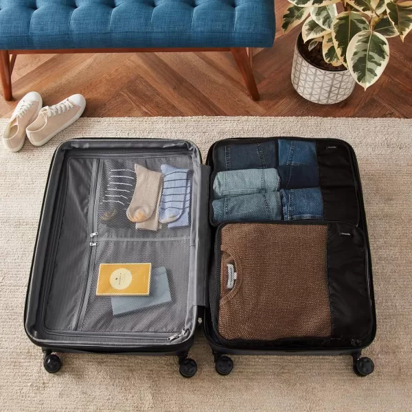 imageAmazon Basics Lightweight Packing Cubes for Travel 4 Piece Set With Double Zipper Pulls and Mesh Top Panel 100 Durable Polyester Small Sky BlueBlack