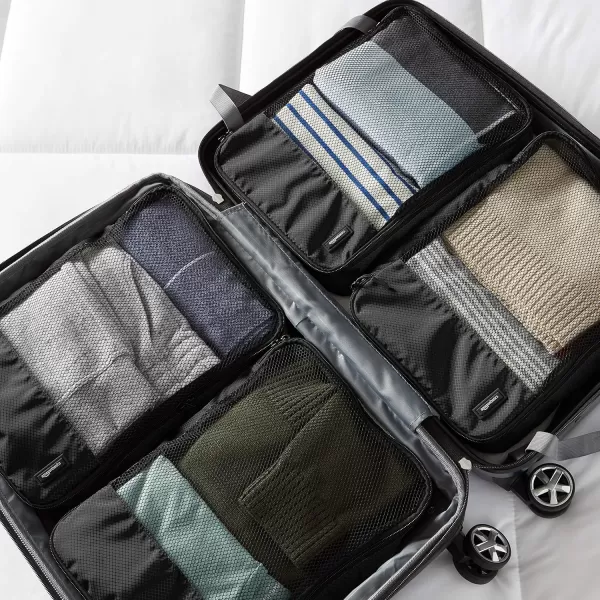 imageAmazon Basics Lightweight Packing Cubes for Travel 4 Piece Set With Double Zipper Pulls and Mesh Top Panel 100 Durable Polyester Small Sky BlueBlack