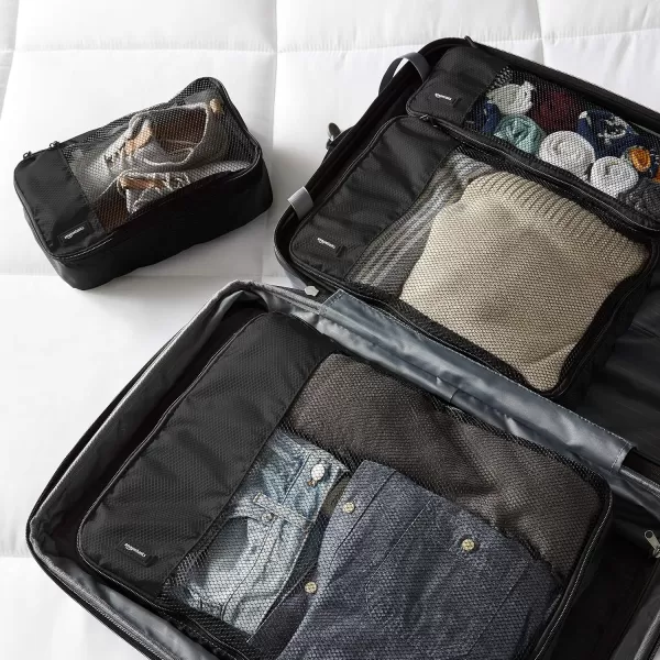 imageAmazon Basics Lightweight Packing Cubes for Travel 4 Piece Set With Double Zipper Pulls and Mesh Top Panel 100 Durable Polyester Small Sky BlueBlack