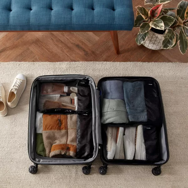 imageAmazon Basics Lightweight Packing Cubes for Travel 4 Piece Set With Double Zipper Pulls and Mesh Top Panel 100 Durable Polyester Small Sky BlueBlack
