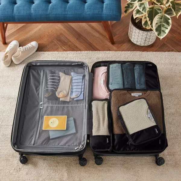imageAmazon Basics Lightweight Packing Cubes for Travel 4 Piece Set With Double Zipper Pulls and Mesh Top Panel 100 Durable Polyester Small Sky BlueBlack