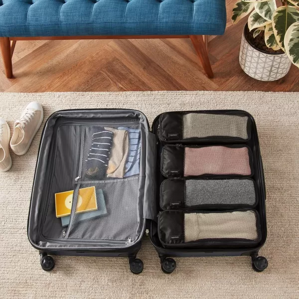 imageAmazon Basics Lightweight Packing Cubes for Travel 4 Piece Set With Double Zipper Pulls and Mesh Top Panel 100 Durable Polyester Small Sky BlueBlack