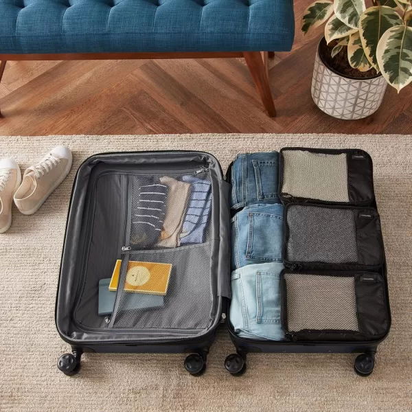 imageAmazon Basics Lightweight Packing Cubes for Travel 4 Piece Set With Double Zipper Pulls and Mesh Top Panel 100 Durable Polyester Small Sky BlueBlack