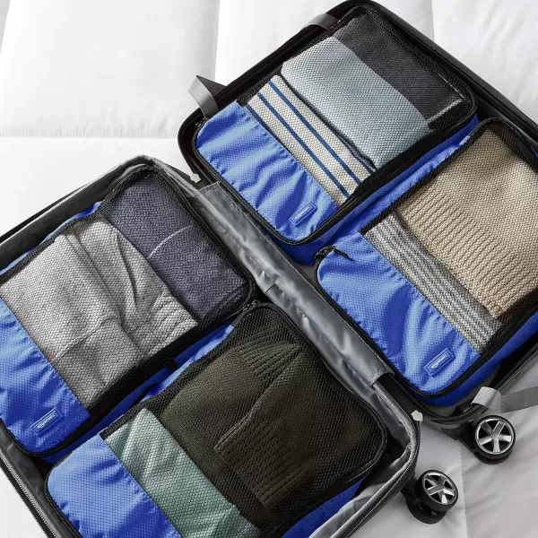 imageAmazon Basics Lightweight Packing Cubes for Travel 4 Piece Set With Double Zipper Pulls and Mesh Top Panel 100 Durable Polyester Small Sky BlueBlue