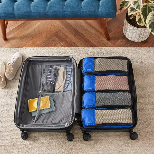 imageAmazon Basics Lightweight Packing Cubes for Travel 4 Piece Set With Double Zipper Pulls and Mesh Top Panel 100 Durable Polyester Small Sky BlueBlue