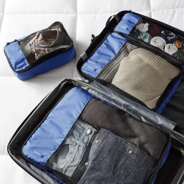 imageAmazon Basics Lightweight Packing Cubes for Travel 4 Piece Set With Double Zipper Pulls and Mesh Top Panel 100 Durable Polyester Small Sky BlueBlue